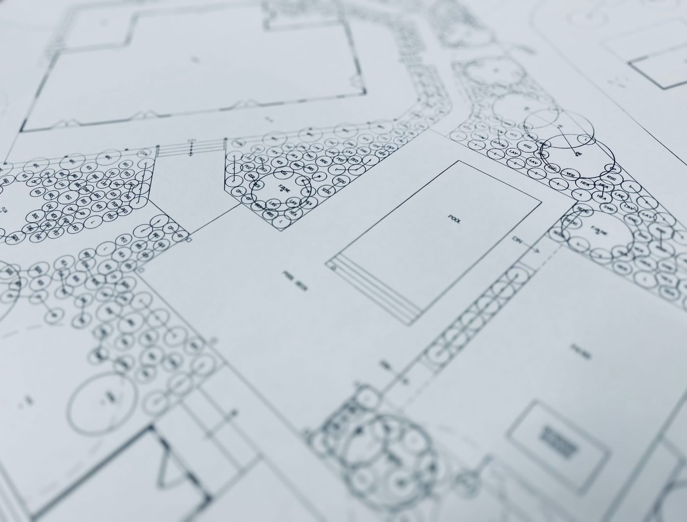 Planting plan detail around a pool with pool house and hardscape